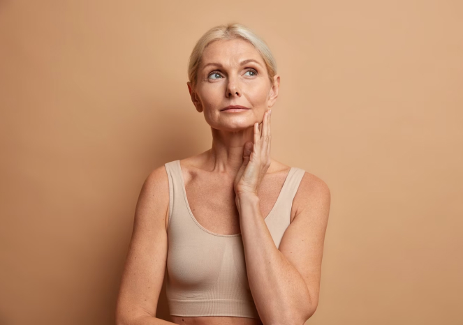 Mature woman touching face