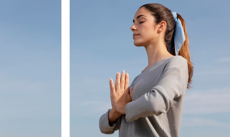 Woman meditating blue sky