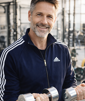 Man in the tracksuit is smiling