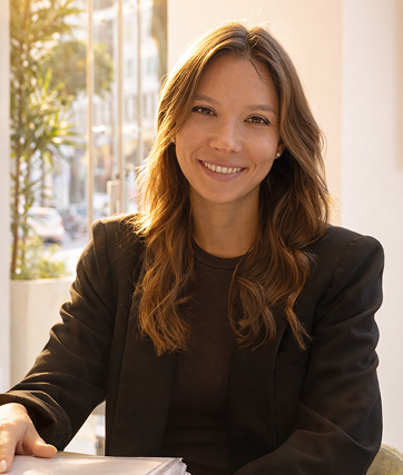 Woman in the black blazer is smiling