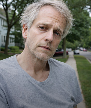 Man in the grey t-shirt is sad